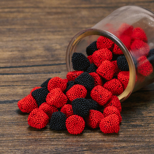 red raspberry and black blackberry bite-sized gummies in a half pound bag - with nonpareil sprinkles.