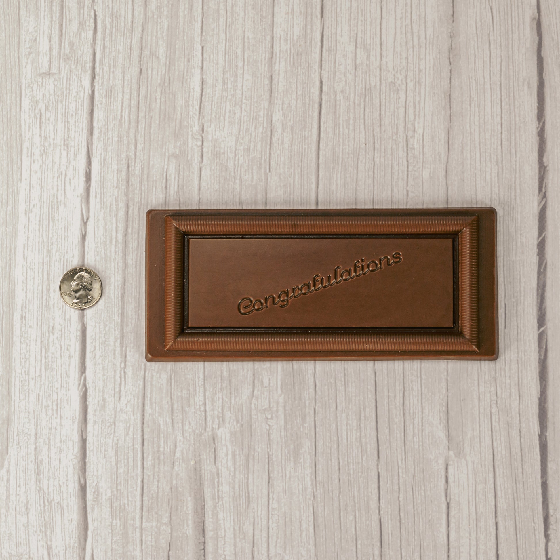 a rectangle solid milk chocolate bar that reads "Congratulations"