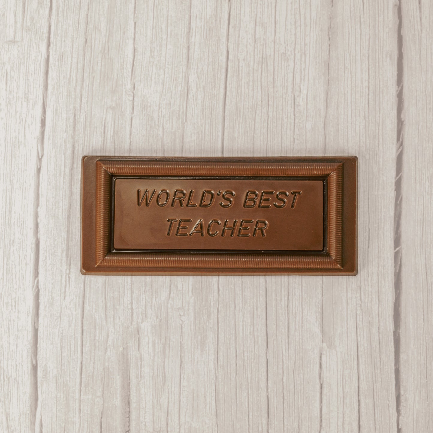 solid milk chocolate rectangle bar that reads "world's best teacher'
