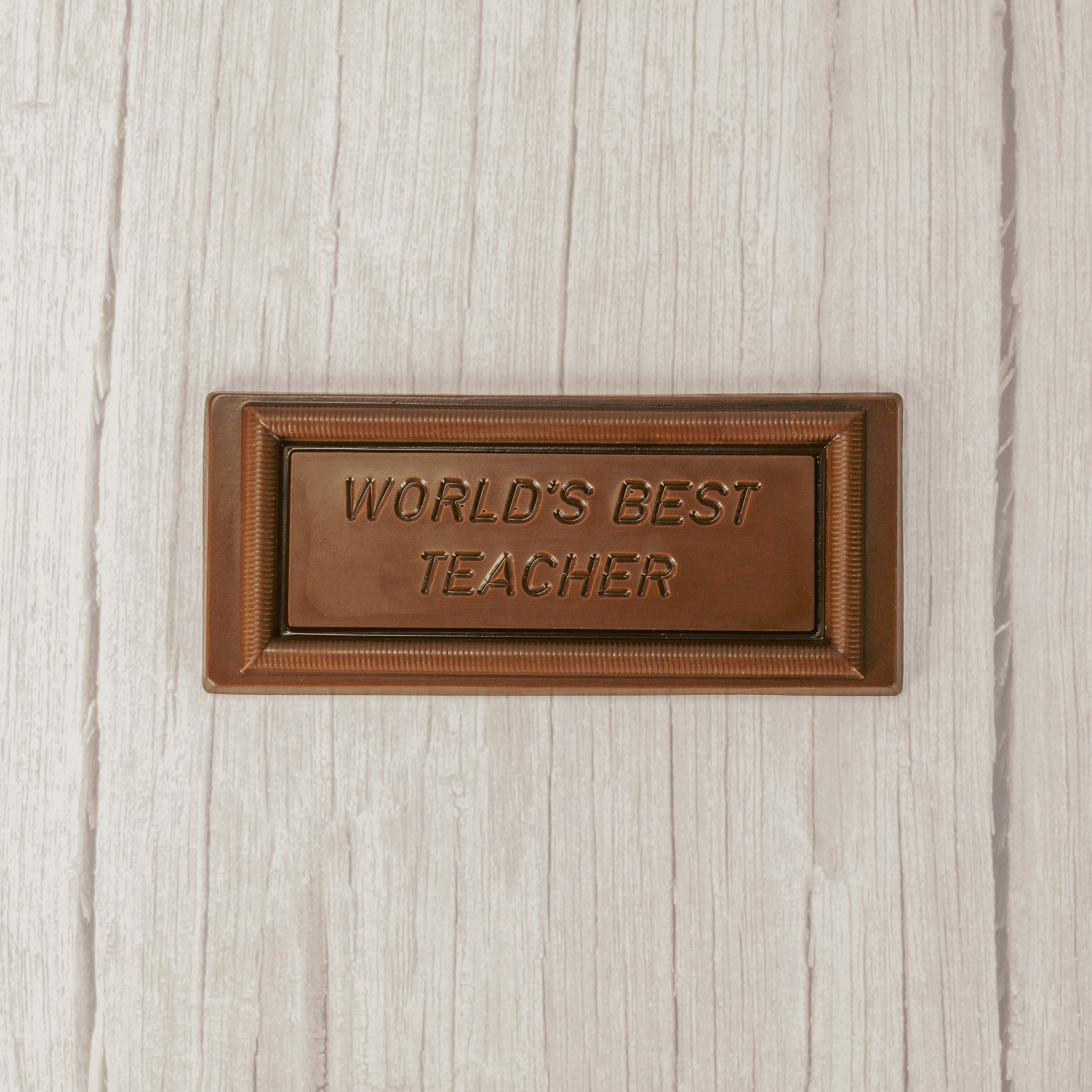 solid milk chocolate rectangle bar that reads "world's best teacher'