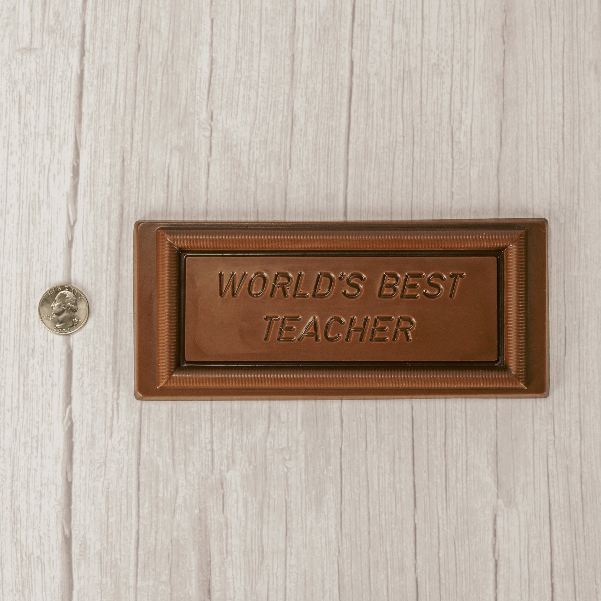 solid milk chocolate rectangle bar that reads "world's best teacher'