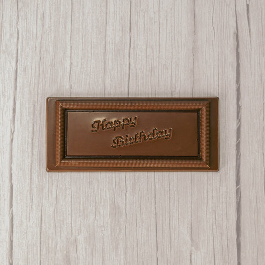 a rectangle solid milk chocolate bar that reads "Happy Birthday"