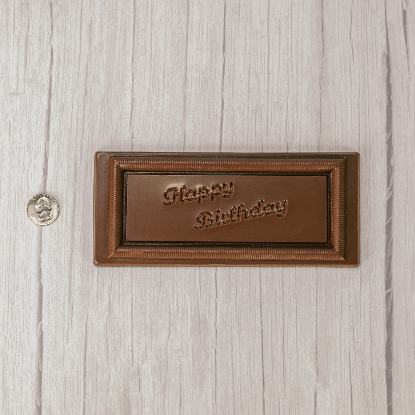 a rectangle solid milk chocolate bar that reads "Happy Birthday"