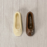 a ballet slipper in milk chocolate or white coating. Individually wrapped.