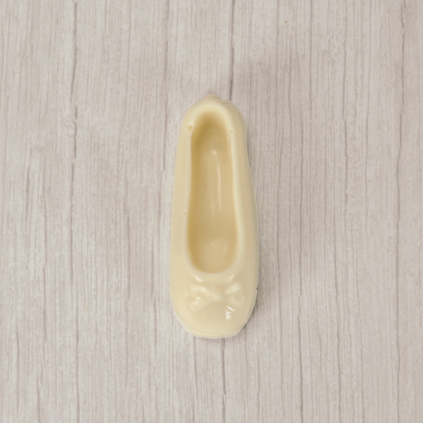 a ballet slipper in milk chocolate or white coating. Individually wrapped.