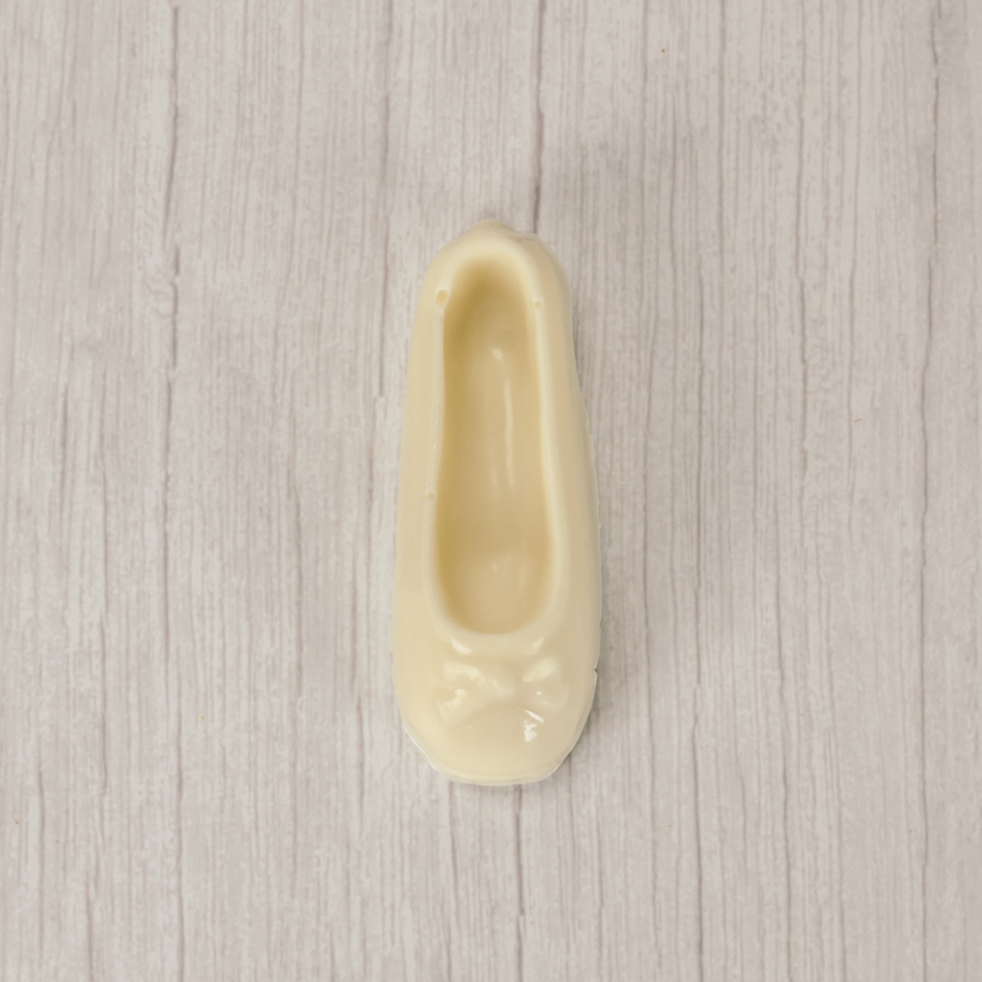 a ballet slipper in milk chocolate or white coating. Individually wrapped.