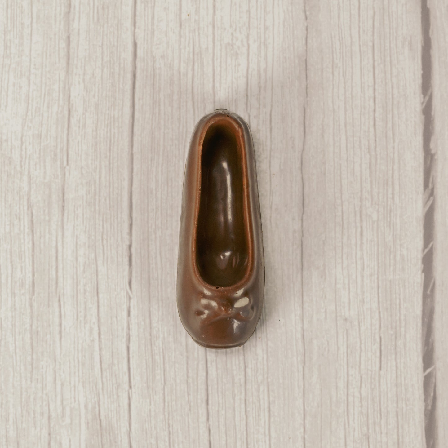 a ballet slipper in milk chocolate or white coating. Individually wrapped.