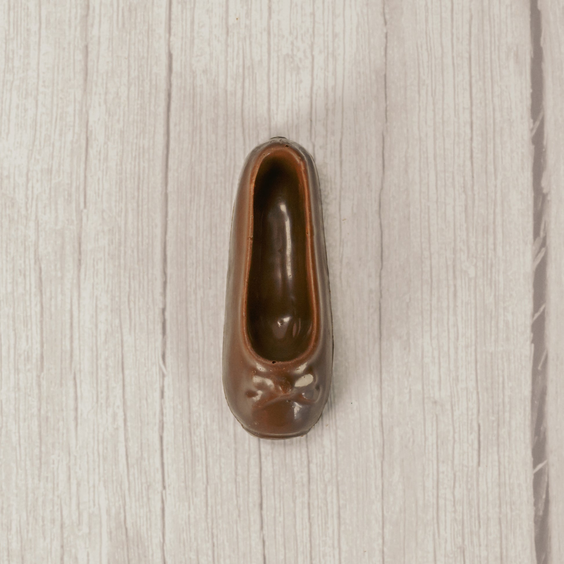 a ballet slipper in milk chocolate or white coating. Individually wrapped.