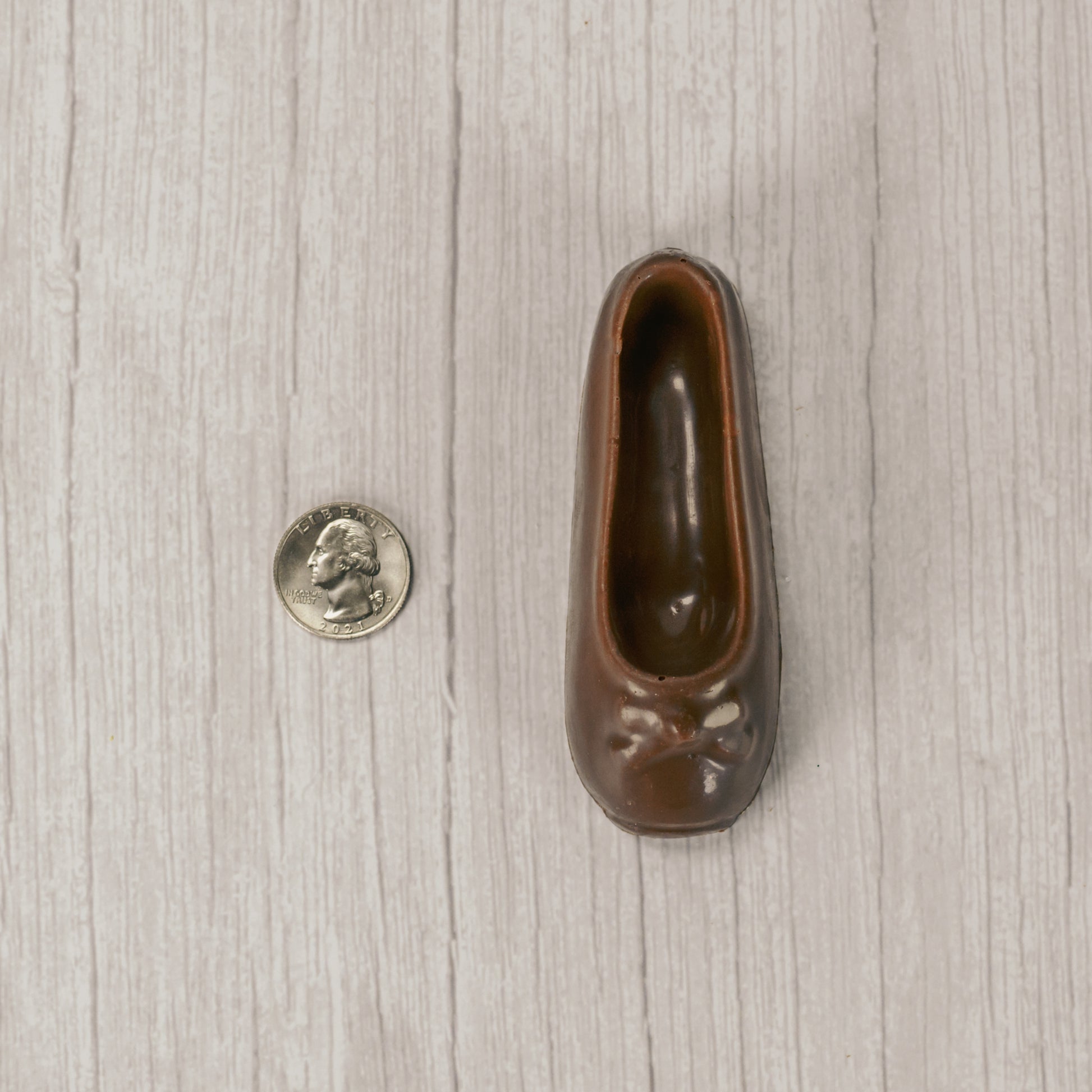 a ballet slipper in milk chocolate or white coating. Individually wrapped.