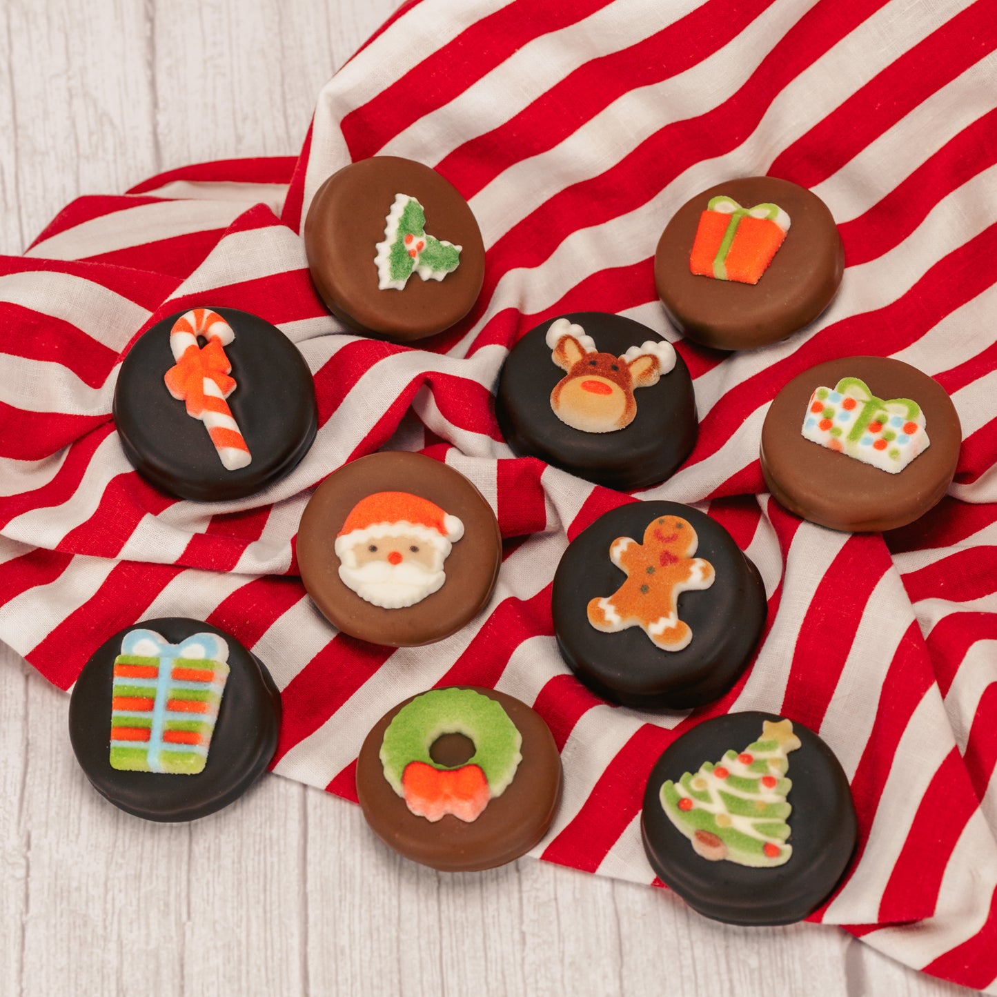 Oreo cookies covered in smooth milk chocolate or rich chocolate and decorated with a sugar Christmas decoration