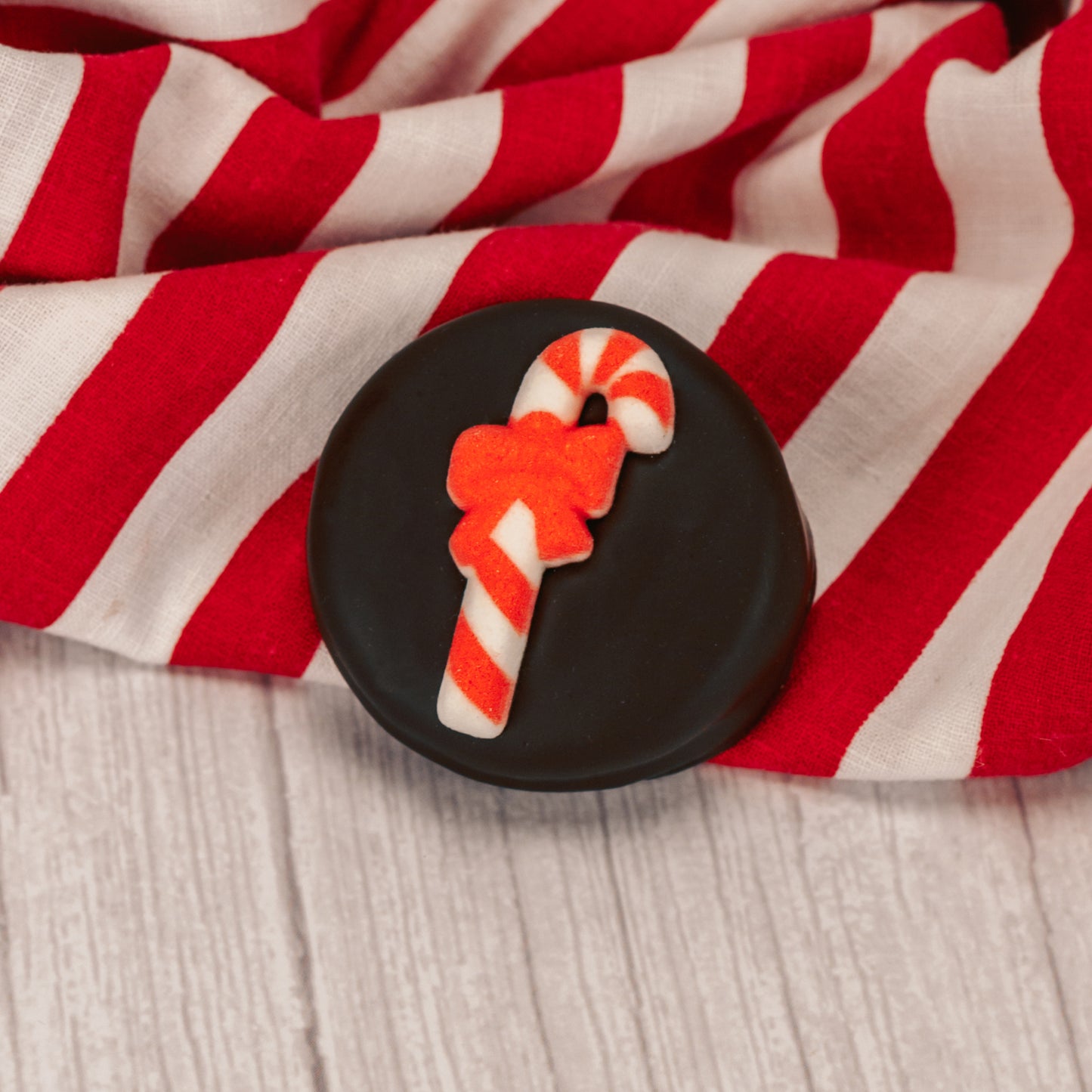 Oreo cookies covered in smooth milk chocolate or rich chocolate and decorated with a sugar Christmas decoration