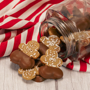 half pound bag of gingerbread cookies dipped with milk chocolate pants.