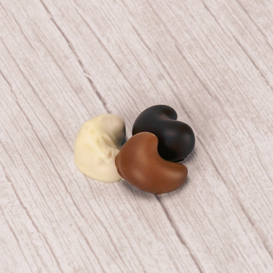 freshly roasted cashews covered in smooth milk chocolate, rich dark chocolate or sweet white coating (tastes like white chocolate)  in a half pound box.