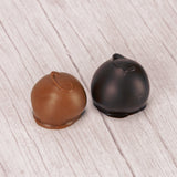 Maraschino cherries wrapped in white cream and dipped in smooth milk chocolate or rich dark chocolate in a one pound box.
