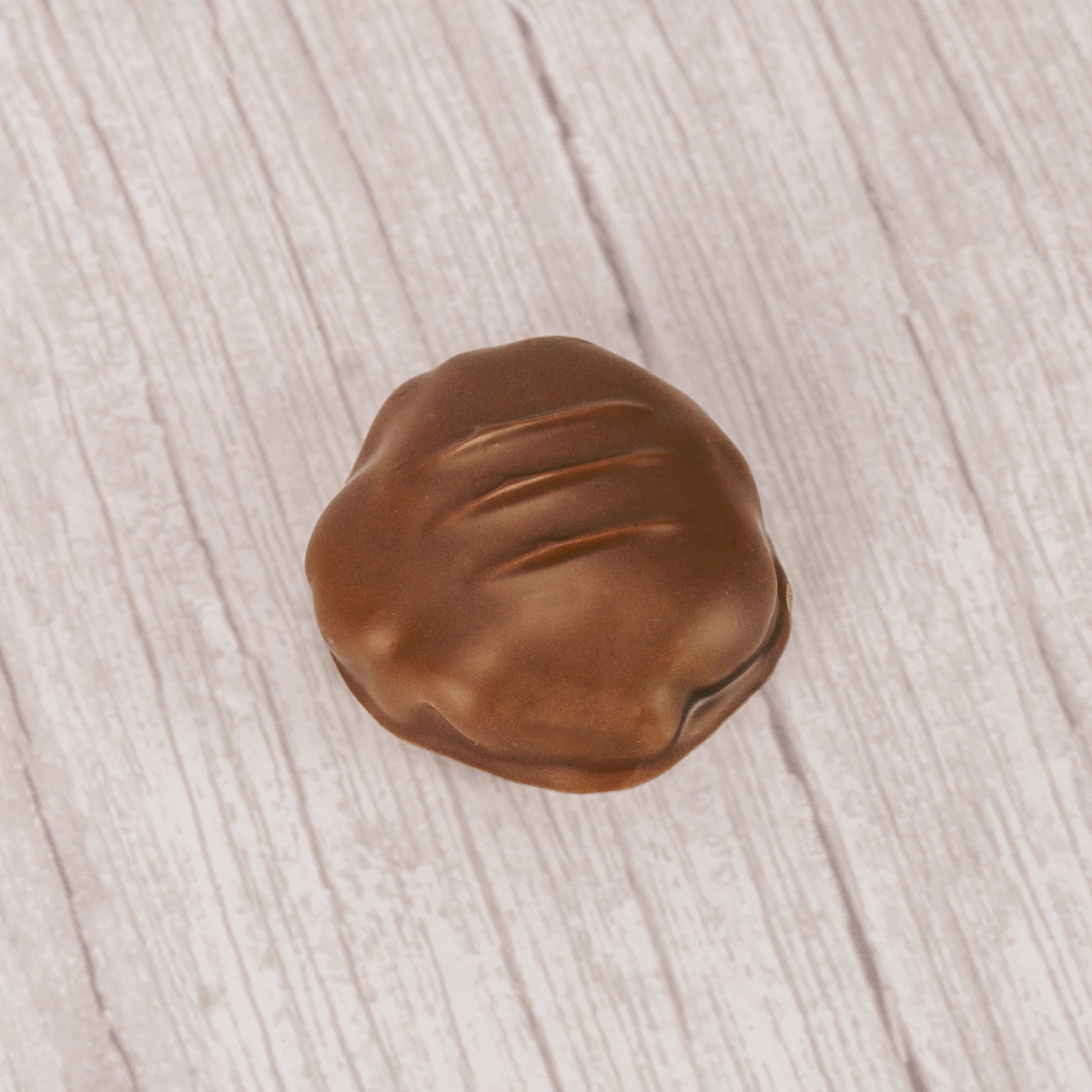 Crushed potato chip pieces with caramel covered in smooth milk chocolate. Sweet and salty combination in a pound box.