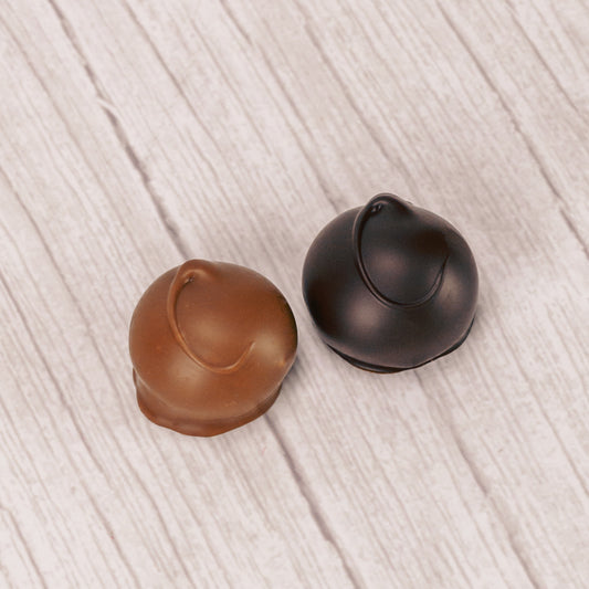 A fudgy chocolate center covered in smooth milk chocolate or rich dark chocolate. Approximately 32 pieces in a pound box.