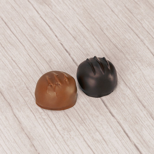 round marshmallow center covered in rich dark chocolate or smooth milk chocolate in a pound box.