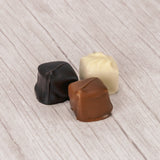 smooth creamy peanut butter center covered in smooth milk chocolate, rich dark chocolate or sweet white coating (like white chocolate). Approximately 32 pieces in a one pound box.