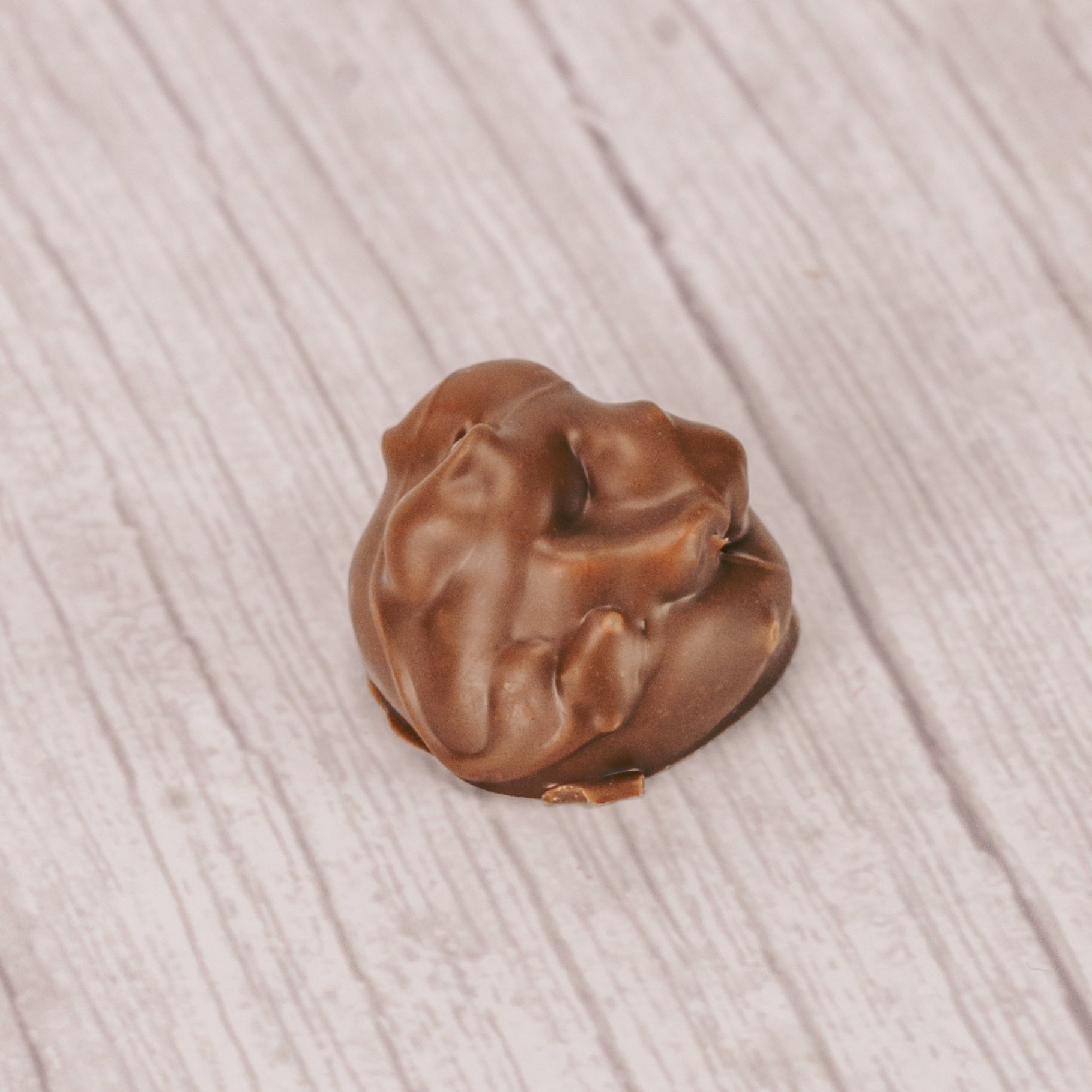 Maple cream topped with peanuts and covered in milk chocolate. One pound box