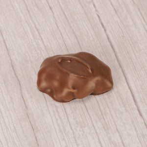 A pound of peanut and caramel pieces covered with milk chocolate.