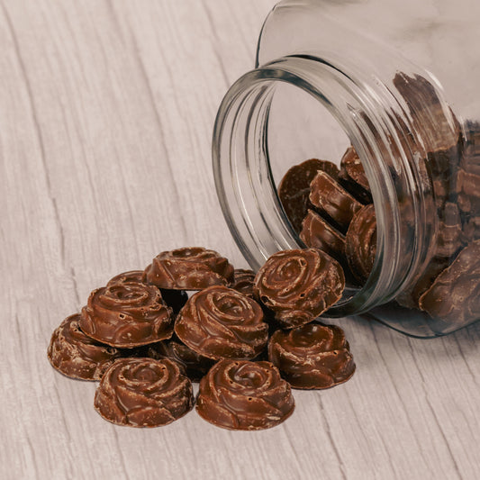 Solid milk chocolate pieces that look like roses and are bite-sized. Half pound