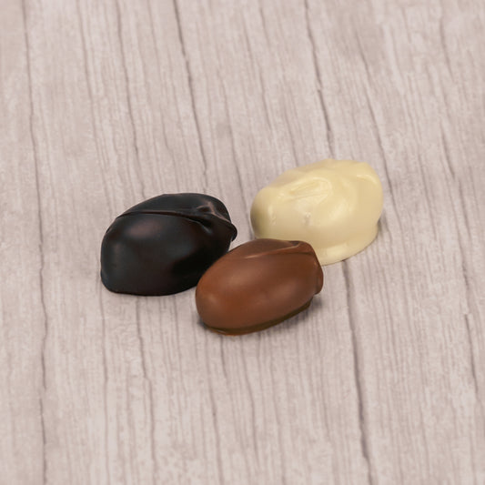Marie's signature piece - a chewy peppermint molasses piece coated in smooth milk, rich dark chocolate or white coating (tastes like white chocolate). One pound box.