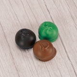 Rich vanilla cream center covered in smooth milk chocolate, rich dark chocolate or sweet green coating (tastes like white chocolate). Approximately 32 pieces in a in a pound box.