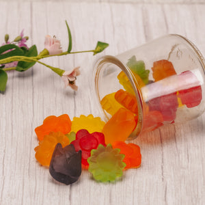 Gummi bite size shapes of flowers. Assorted colors. In half pound bags.