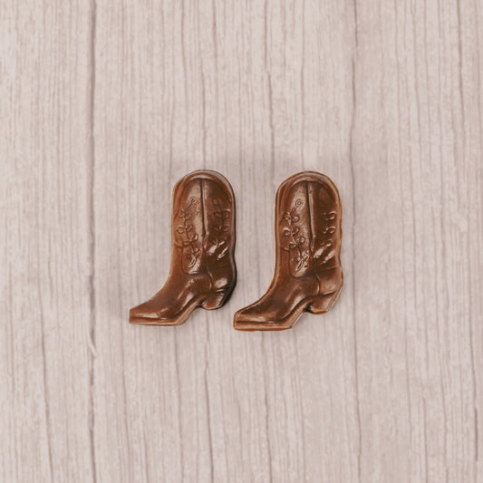 a pair of tiny milk chocolate cowboy boots.