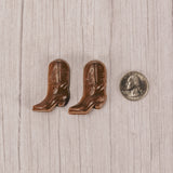 a pair of tiny milk chocolate cowboy boots.