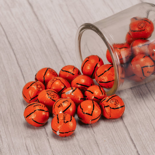 a half pound bag of milk chocolate foil wrapped basketballs. approximately 31 in a half pound.