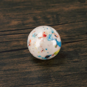 a giant 2 1/4'' hard candy coated jawbreaker with multiple layers with a candy center will keep you busy for a while! 