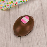 This egg has a rich fudgy chocolate center and is covered in milk or dark chocolate. Assorted sugar and icing decorations, choose a quarter pound, half pound or one pound egg.