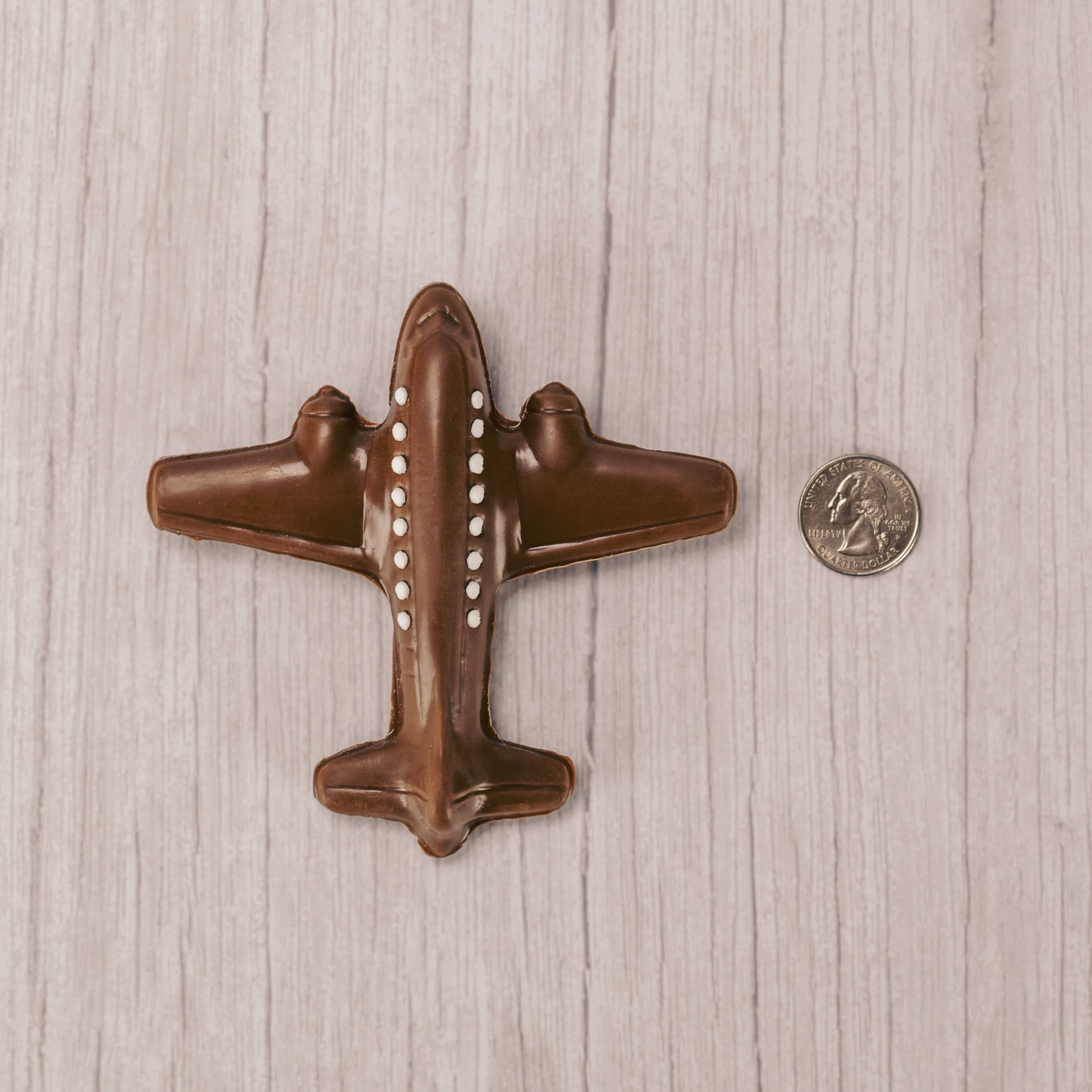 solid 2 oz. milk chocolate airplane with white windows (made from icing)