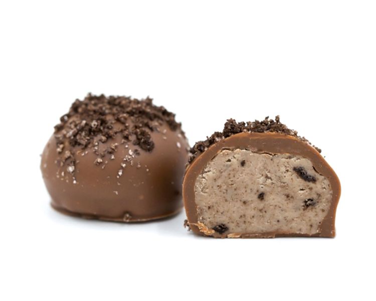 a rich vanilla cream mixed with crushed oreo cookies and covered with smooth milk chocolate with cookie crumb sprinkles on top.