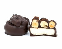a rich vanilla cream center with freshly roasted peanuts on top and dipped in rich dark chocolate. 
