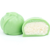 Rich vanilla cream center covered in green coating in a pound box.