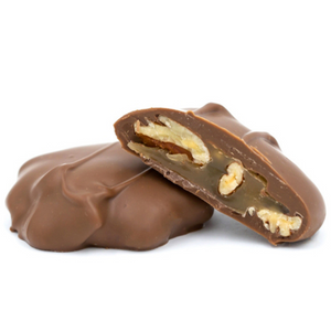  tur'Kins, like a turtle, with pecans and caramel dipped in smooth milk chocolate, rich dark chocolate, or white coating (tastes like white chocolate) in a pound box, approximately 20.