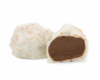 chocolate cream center covered in white coating with pieces of toasted coconut.
