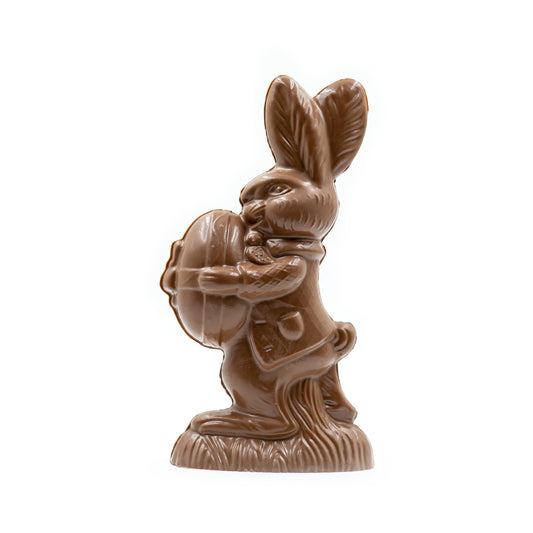 Almost three pound of milk chocolate, Hopkin's the Butler is holding a large egg in front of him.