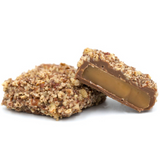 a pound box of butter crunch center (like toffee) covered in milk chocolate and sprinkled with crushed pecans